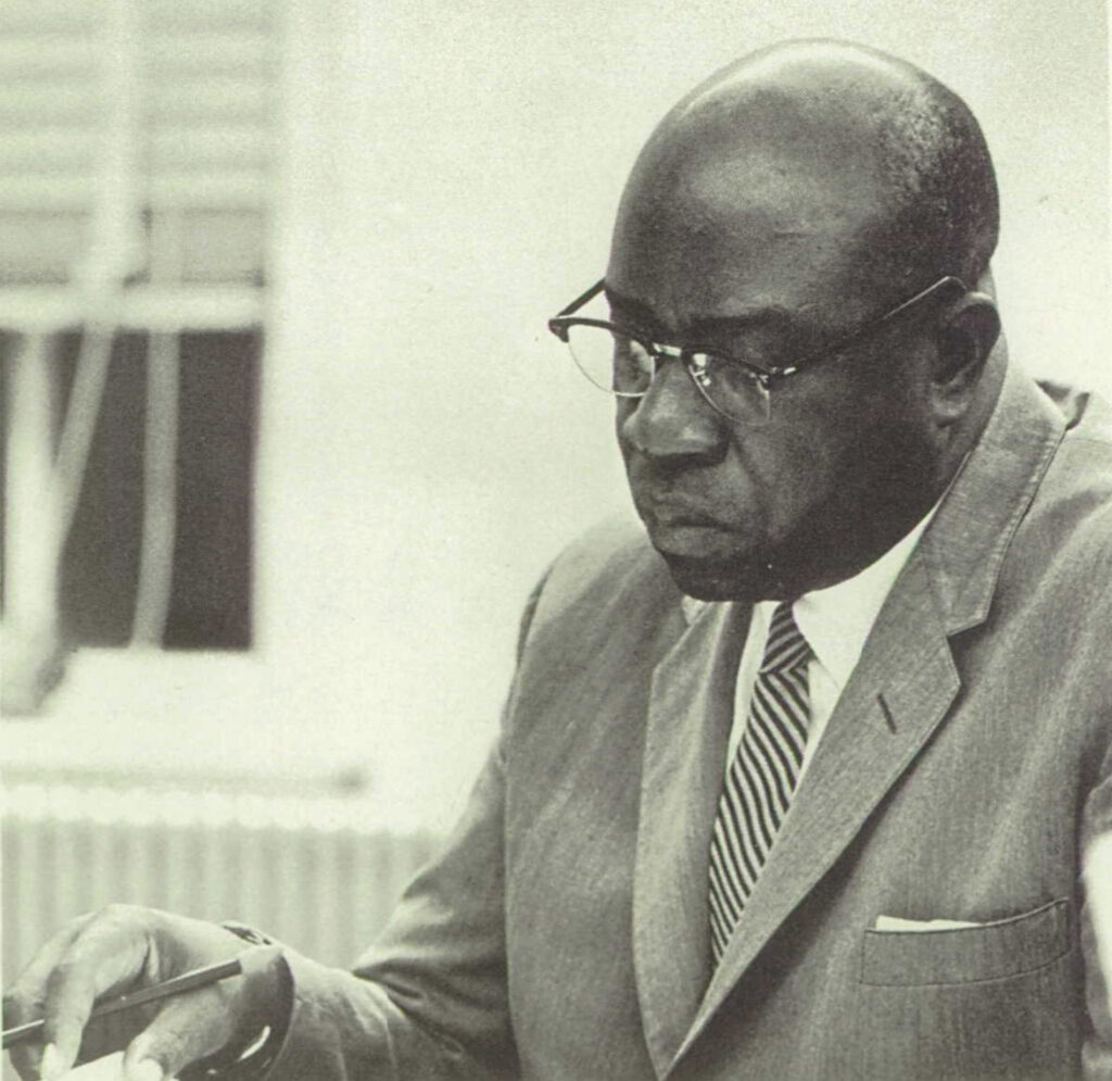 A photo of Theodore Speigner looking at papers when he was elected to the Durham, North Carolina, school board.