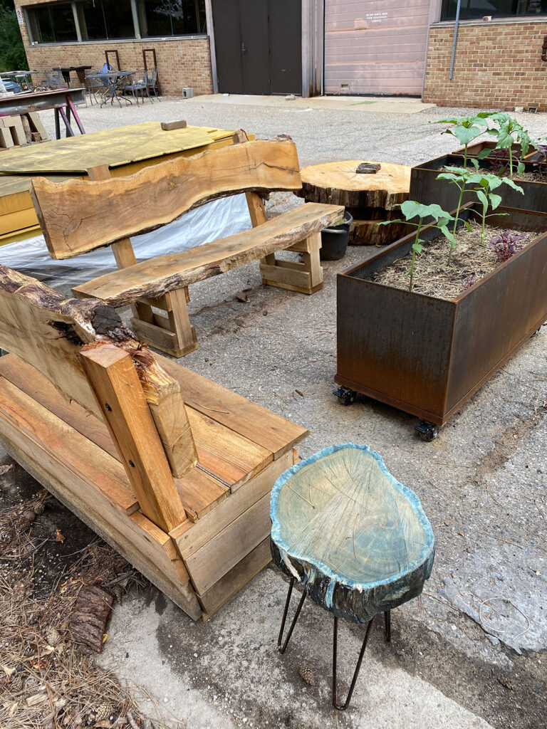 The Stamps Sustainable Materials & Color Garden features benches, stools and a table that were built from the historic Tappan Oak. (Photo by Scott C. Soderberg, Michigan Photography)