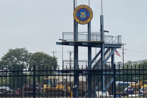 Elbel Field under construction. Band logo with construction trucks at field.