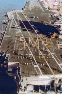 The Block M formation on the deck of the USS Kittyhawk.