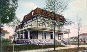 Prettyman's boarding house, a large three-story home with wraparound porch.
