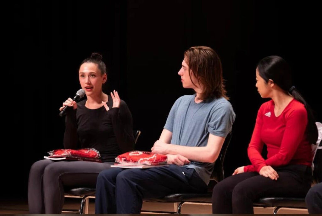 Rileigh Goldsmith (speaking), Robert Farr-Jones, Professor Fangfei Miao.