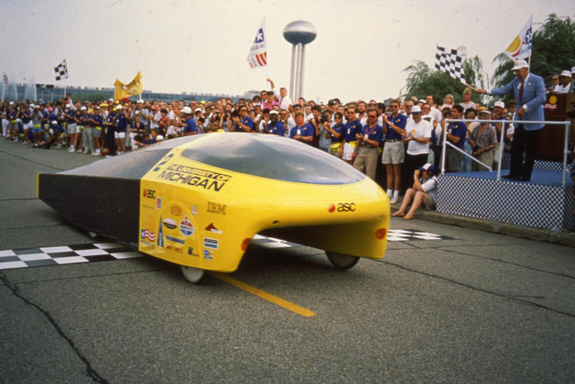 A photo of the Sunrunner solar-powered car crossing the finish line