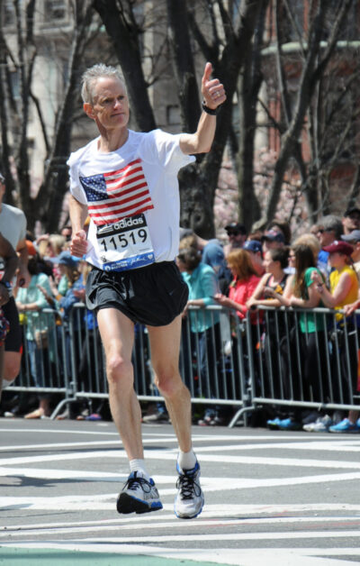 A photo of Chris Roberts running in the 2014 Boston Marathon