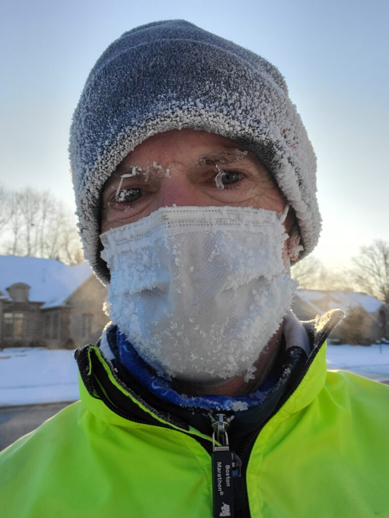 A photo of Chris Roberts with ice on his face after a wintry morning run