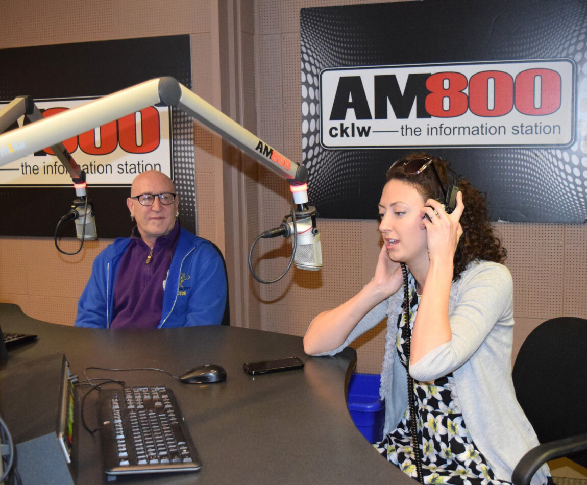 A photo of a man and a woman in a radio studio.