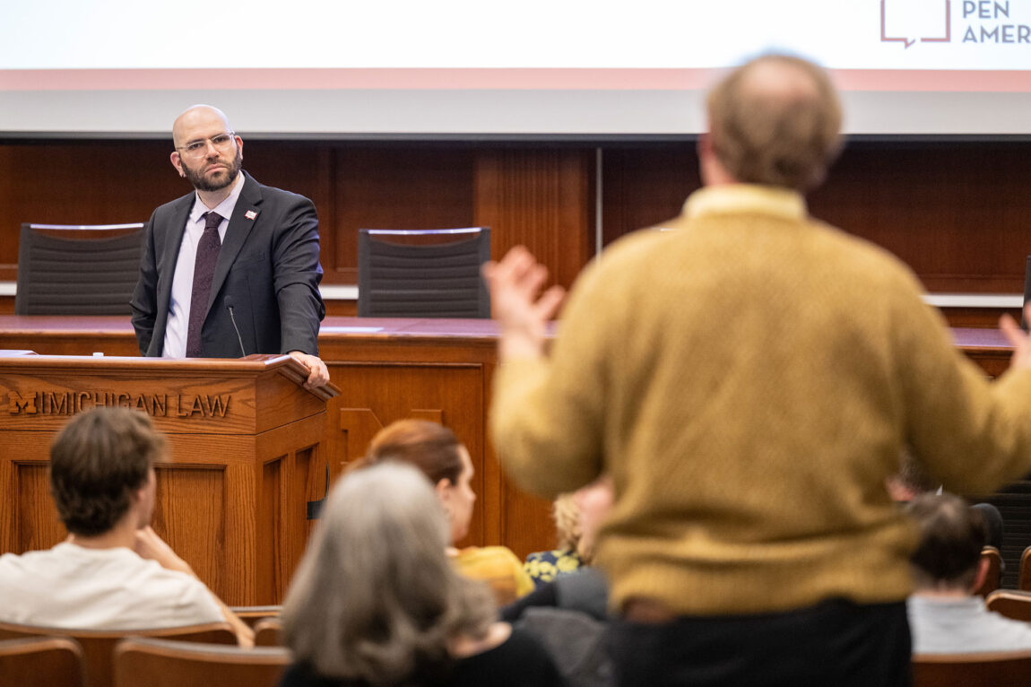Photo of Jonathan Friedman considering a question from an audience member.