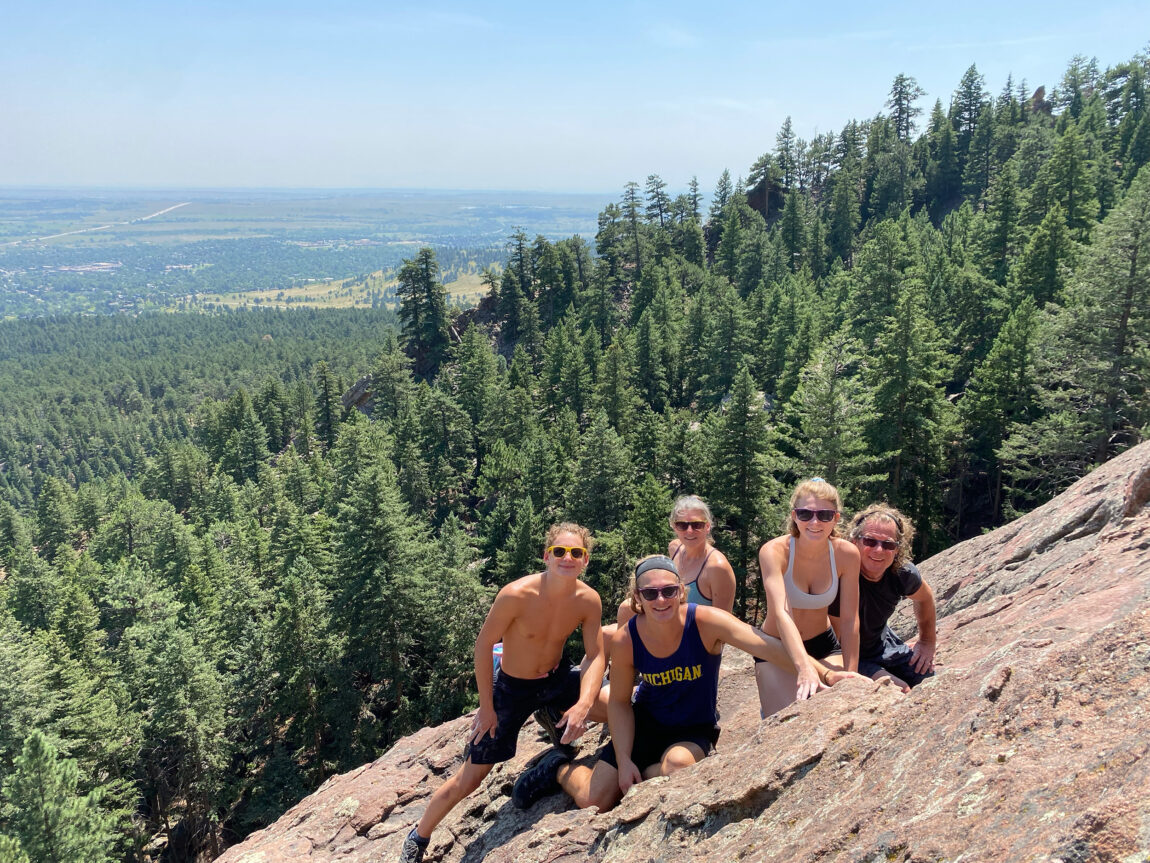 A photo of a family after climbing rock formations in Colorado.