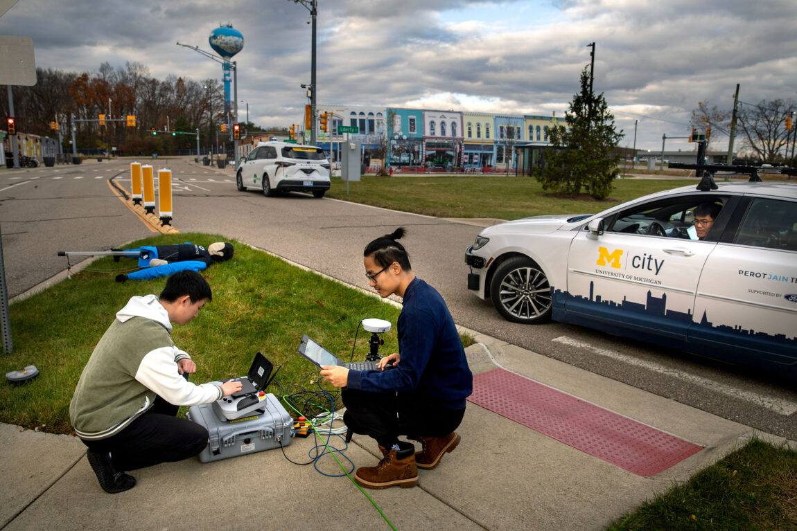 A photo of three U-M researchers at Mcity.