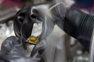 Clare Langhan, a University of Michigan PhD student in mechanical engineering, spincoats thin-film perovskite samples in glovebox—a key step in the creation of perovskite solar cells. Image credit: Marcin Szczepanski/Lead Multimedia Storyteller, Michigan Engineering
