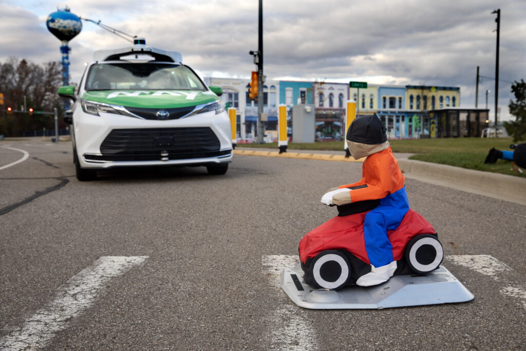 The Driverless May Mobility vehicle stops automatically to let a passerby cross the street during the first day of testing to support the City of Detroit's Automated Driving System (ADS) Shuttle. Image credit: Marcin Szczepanski/Lead Multimedia Storyteller, Michigan Engineering