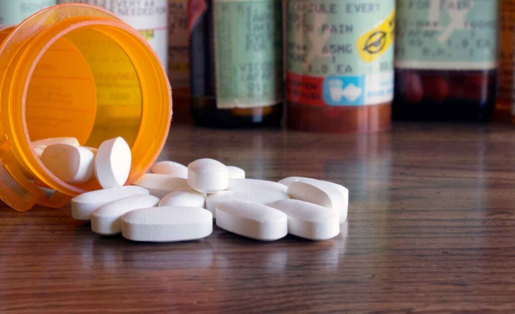 Pills and prescription bottles. Image courtesy: U-M Poverty Solutions