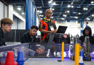 Pryor says coaching the robotics team helps to train students for 21st century jobs. Image credit: Elizabeth Conley, special to Michigan Photography.