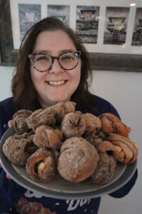 Marissa Wojcik holds a plate of her baked goods.