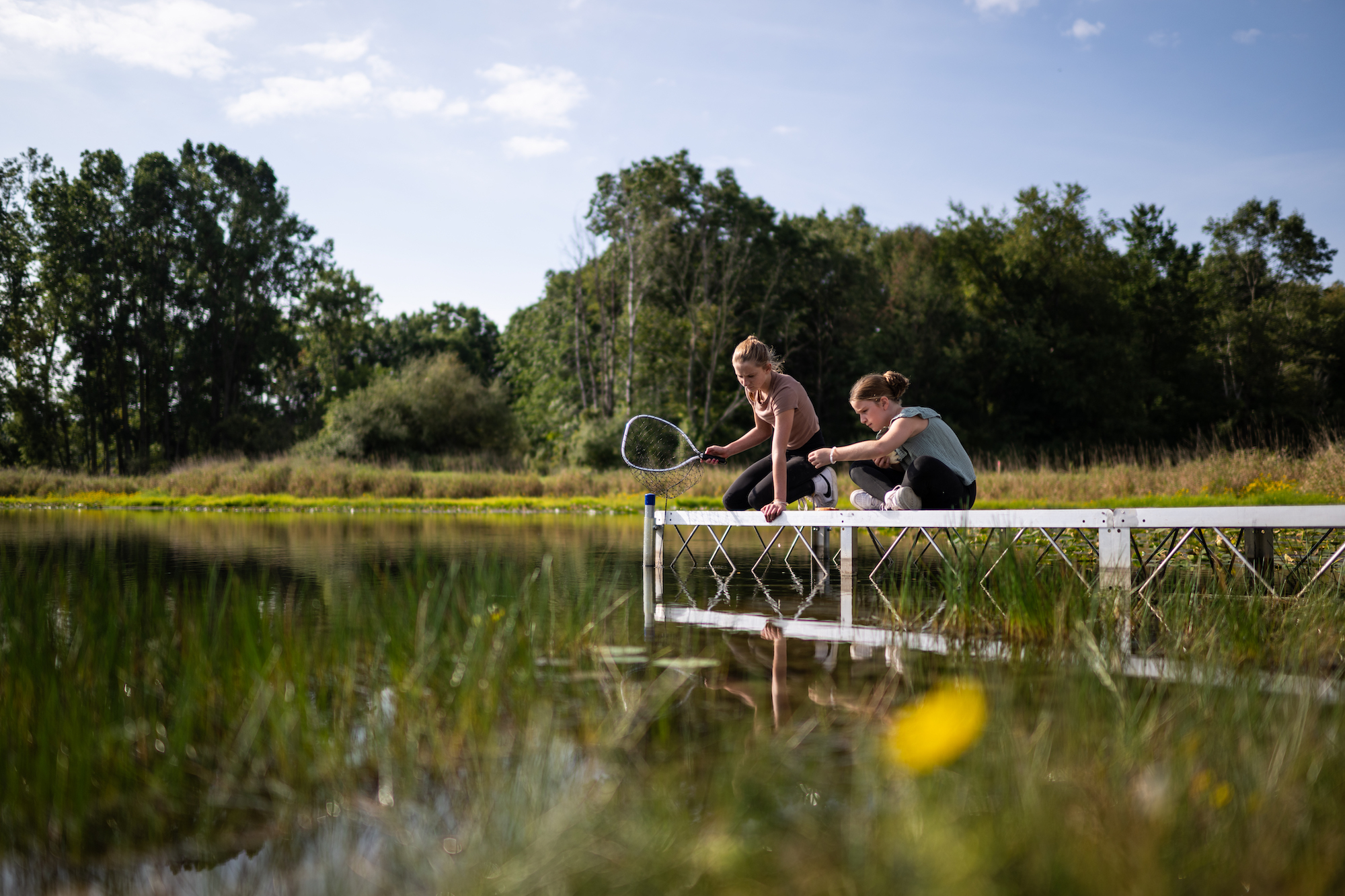 The Irwin girls fish at the farm. Image credit: Austin Thomason, Michigan Photography