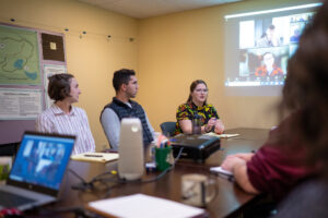 Susan Morley LaCroix meets with colleagues at the Legacy Land Conservancy. Image credit: Eric Bronson, Michigan Photography