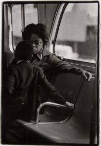 Louis Stettner. On a Westside Bus, Manhattan, NYC (Mother and Son on Bus) gelatin silver print on paper. Image credit: UMMA Exchange