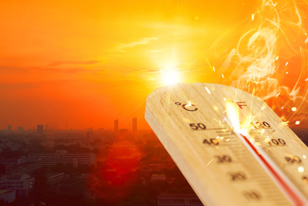 High temperature thermometer with city view. Image credit: coffeekai, iStock