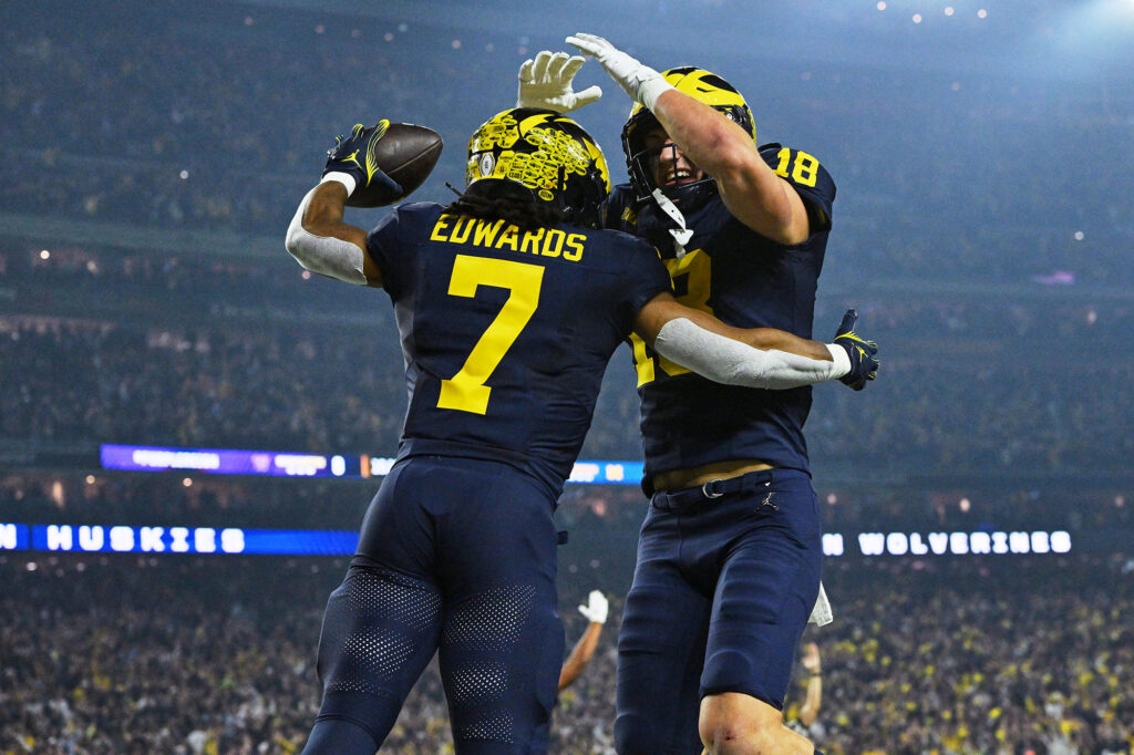 Photo of running back Donovan Edwards celebrating after scoring a touchdown.