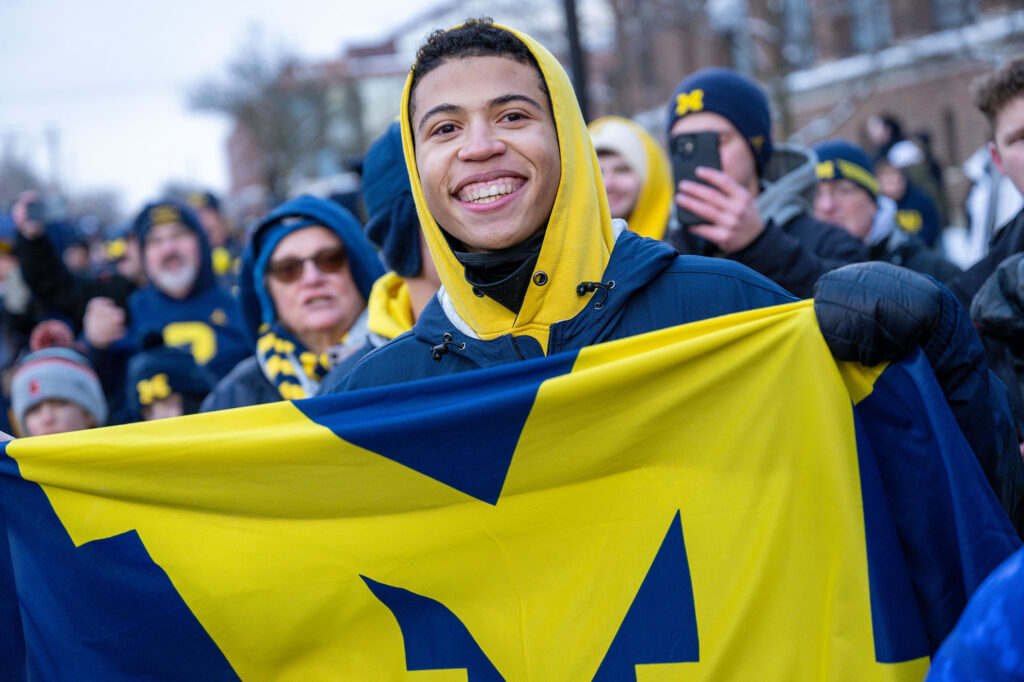 The parade crowd was a sea of maize and blue. 