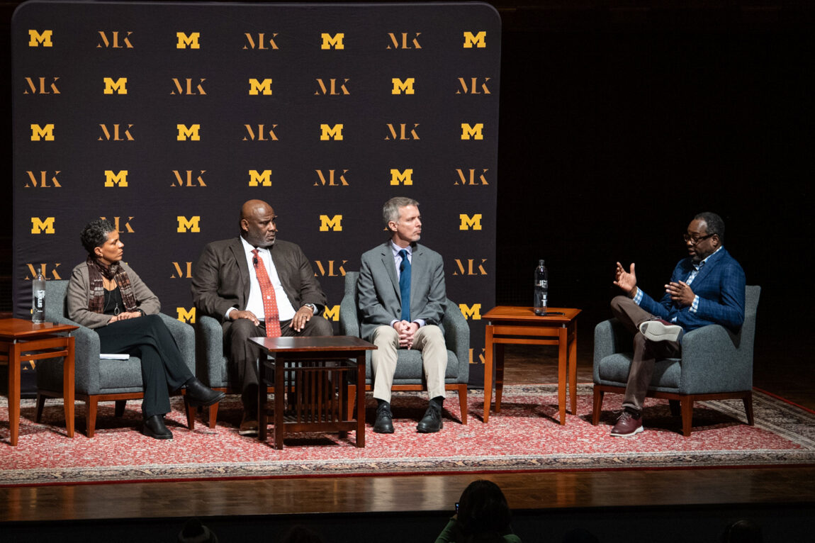 Photo of a discussion panel, from left, Michelle Alexander, Robert Sellers H. Luke Shaefer and Stephen Henderson.