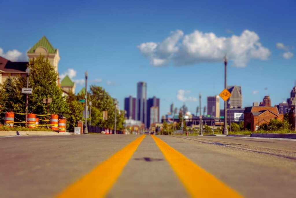 Downtown Detroit with orange and white construction barrels. Image courtesy: Graham Institute