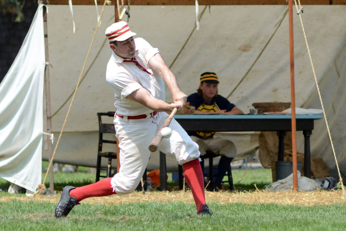 A photo of a man playing vintage baseball