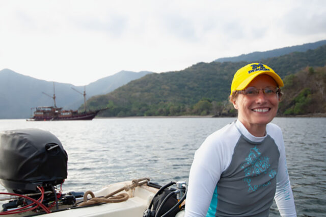 A photo of a woman on a boat