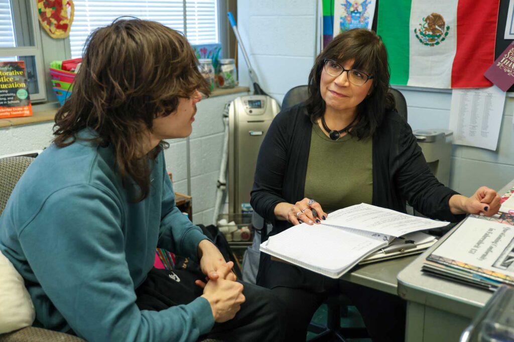 Ylisse Yépez, a teacher at Blissfield High School, privately talks to students if they seem reluctant to express themselves in her English class. Images credit: Jeremy Marble, Michigan News