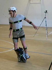 Levente Mihalyi, a graduate student at Budapest, during the one of the experiments with a unicycle while dressed with special markers used for motion tracking.