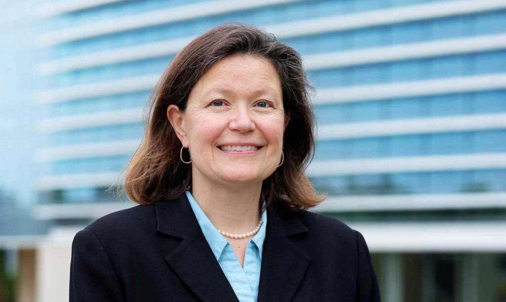 Instrumental in organizing robotics researchers at U-M and championing the need for a facility to bring them together, Dawn Tilbury stands in front of the Ford Robotics Building. Image credit: Brenda Ahearn, Michigan Engineering