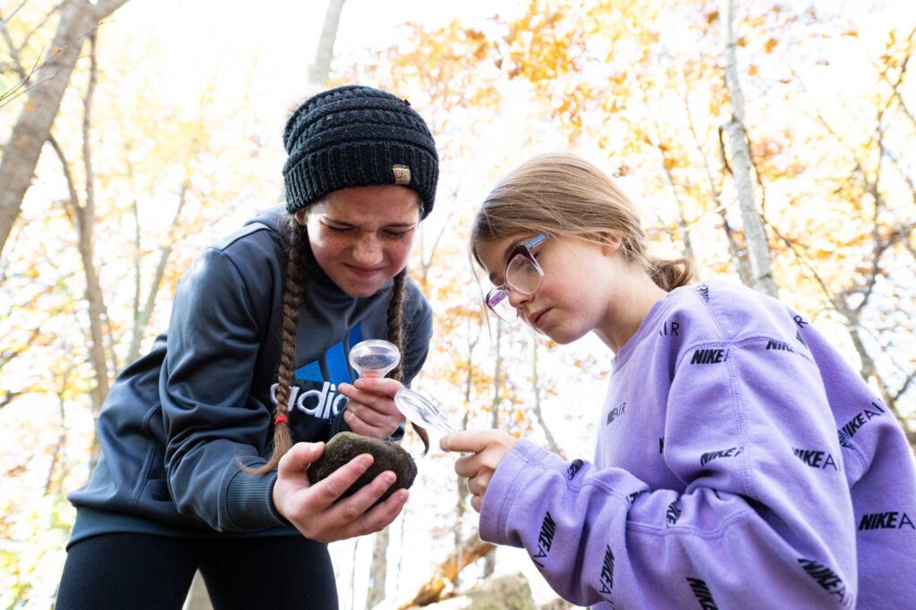 Coleman Elementary students worked in their forest lab, located behind their school last year. Image credit: Eric Bronson, Michigan Photography