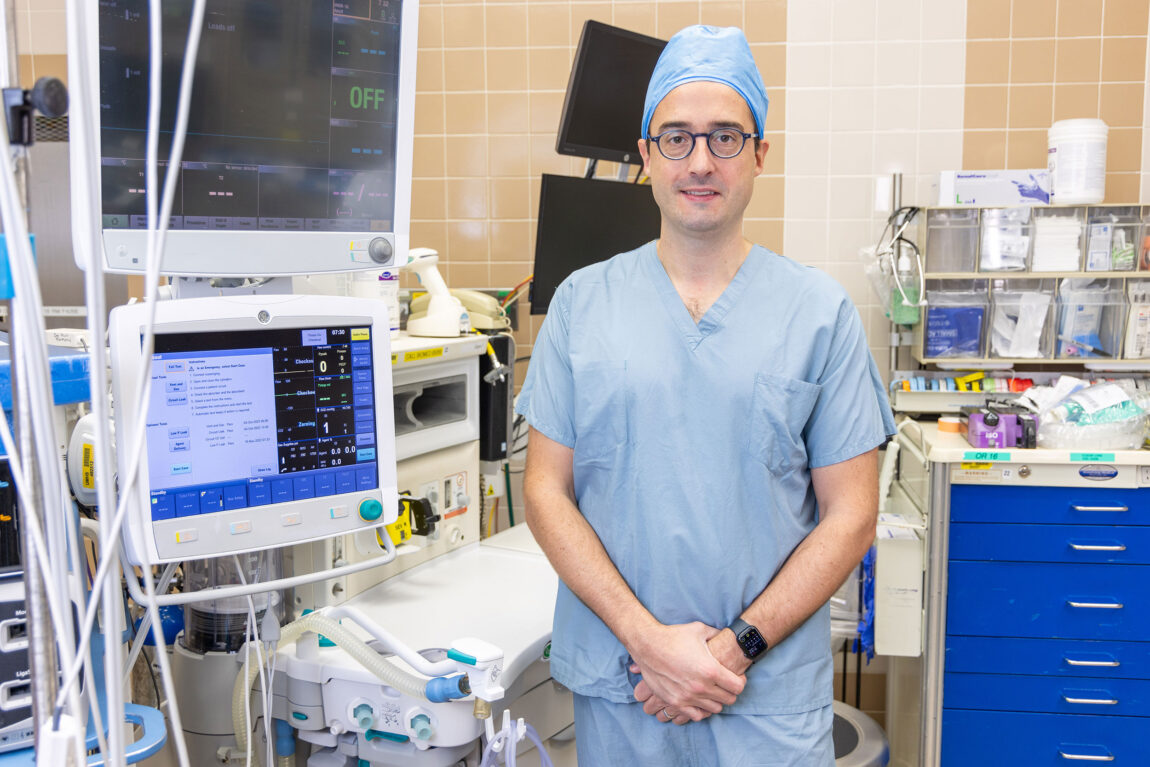 A photo of a man in medical scrubs