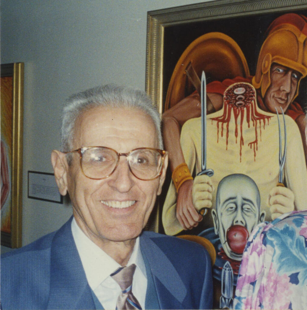 A photo of Jack Kevorkian standing by a painting