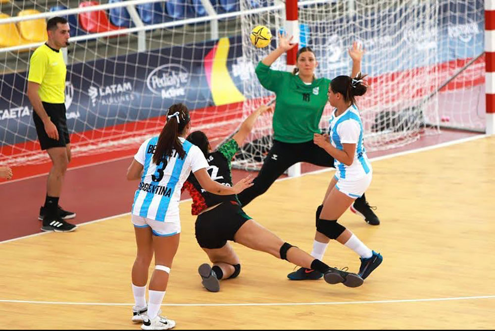 A photo of women playing handball