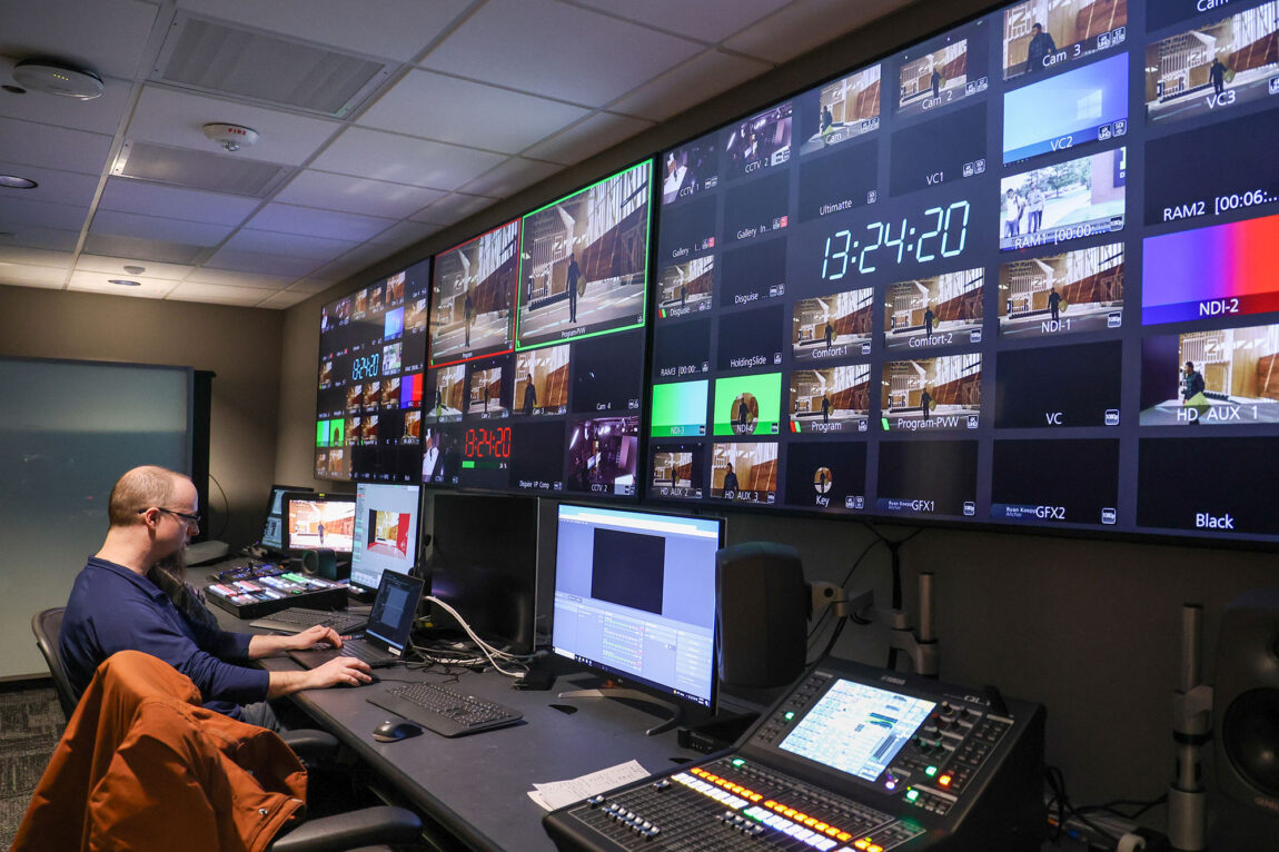 Photo of Eric Schreffler, XR developer at the Center for Academic Innovation, working in the XR studio control room