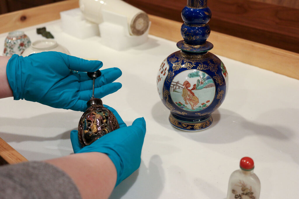 "Pottery snuff bottle with image of a man playing a flute," Chinese, ca. 1825-1900, pottery and enamel, pewter.