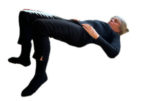 Person on the floor on their back lifting buttocks