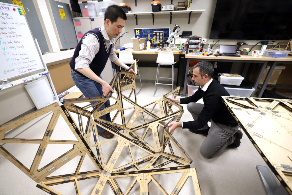 From left, Yi Zhu, a Research Fellow in Mechanical Engineering, and Evgueni Filipov, an associate professor in both Civil and Environmental Engineering and Mechanical Engineering, working in his lab. Image credit: Brenda Ahearn, Michigan Engineering