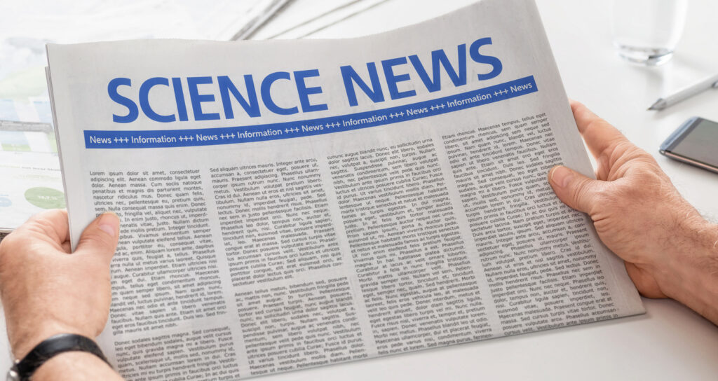 Man reading newspaper with the headline Science News. Image credit: iStock