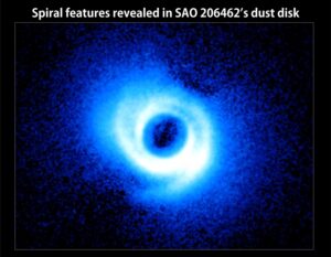 Two spiral arms emerge from the gas-rich disk around SAO 206462, a young star in the constellation Lupus. This image, acquired by the Subaru Telescope and its HiCIAO instrument, is the first to show spiral arms in a circumstellar disk. The image traces the light emitted by the star and scattered on the disk surface. The disk itself is some 14 billion miles across, or about twice the size of Pluto's orbit in our own solar system. Image credit: NAOJ/Subaru