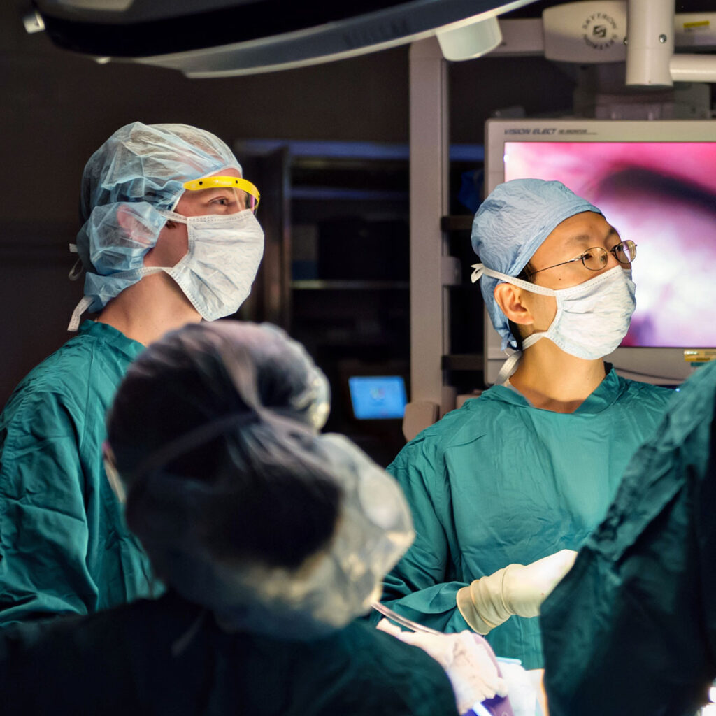 Photo of surgeons in masks and gowns