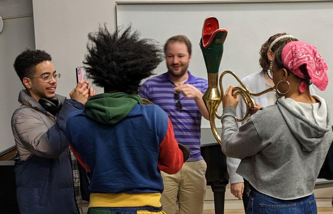 A photo of students with playing instruments
