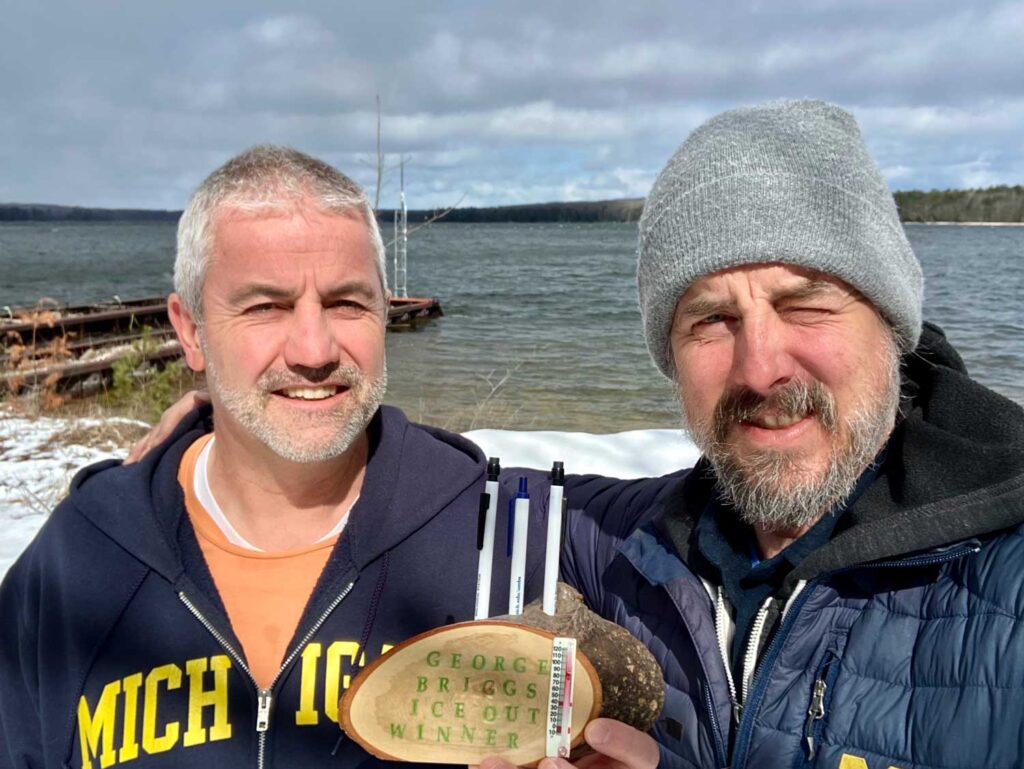 John Lenters, senior research specialist at the U-M Biological Station, left, and Resident Biologist Adam Schubel both won the trophy for the annual staff contest to guess the spring ice-out date on Douglas Lake, which occurred on March 16 this year. Image credit: U-M Biological Station
