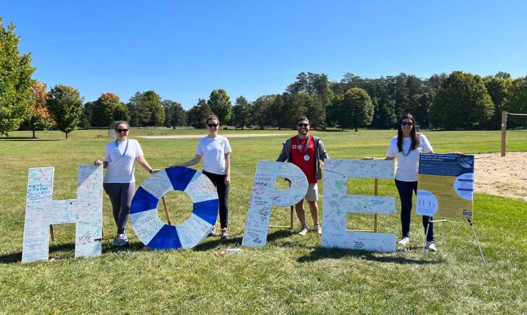 Bornheimer’s team hosted a table with suicide prevention resources and hopeful activities for attendees at the 2023 American Foundation for Suicide Prevention Out of the Darkness Community Walk. From left: Katie Hoener (CMH Program Administrator), Maura Campbell (CMH Provider and Clinical Coordinator in Dr. Bornheimer's STaR Lab), Nicholas Brdar (STaR Lab Manager and Project Coordinator), and Dr. Lindsay Bornheimer (STaR Lab director) Image credit: William Bornheimer