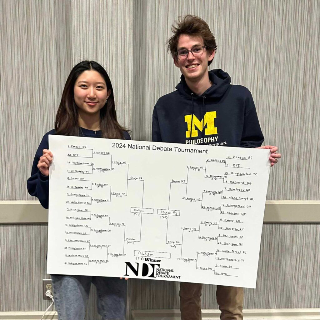 Michigan debaters Kelly Phil and Bennett Dombcik won the 2024 National Debate Tournament on a 5-0 decision against the University of Kansas. Image courtesy: Aaron Kall
