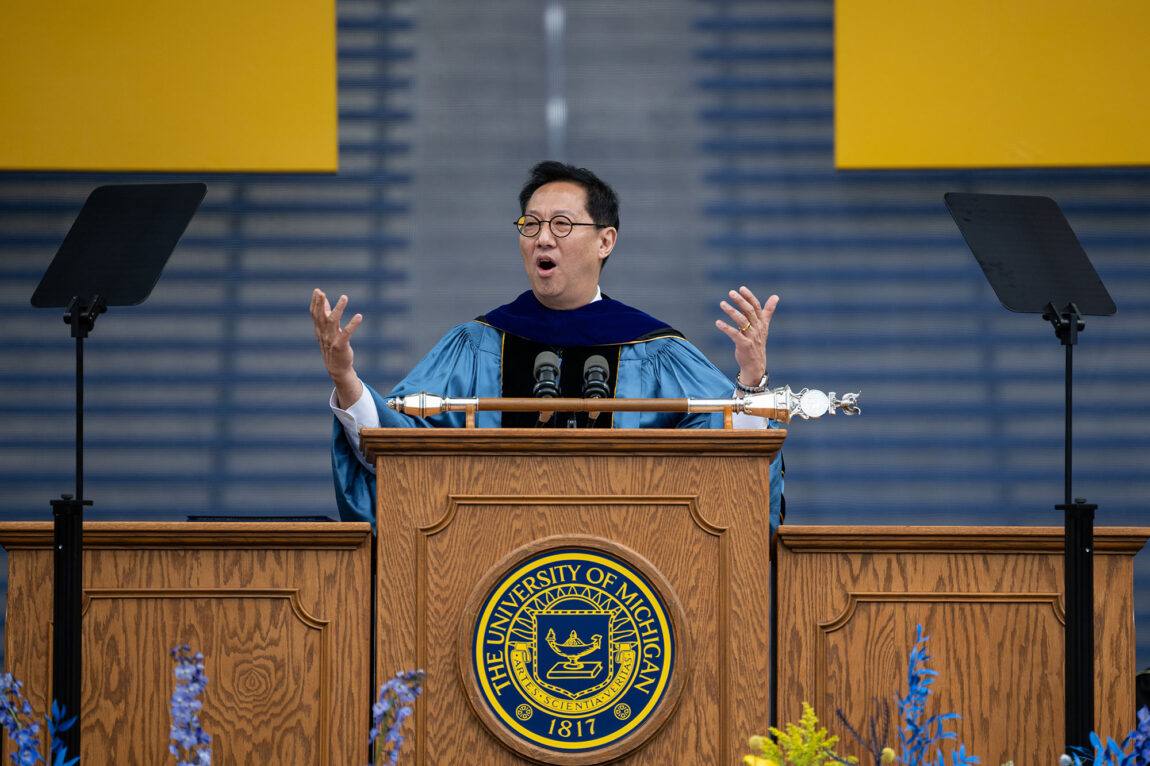 Presidet Santa J. Ono congratulates the graduate at the Spring Commencement ceremony.