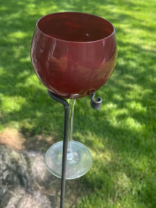 A photo of a wine glass holder made through blacksmithing