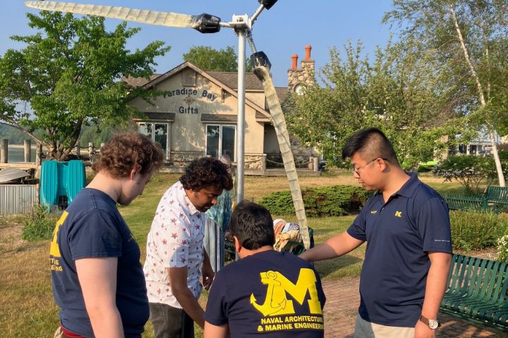 Group of Michigan students working on the construction of a marine wave energy turbine. Photo courtesy of the Graham Sustainability Institute.