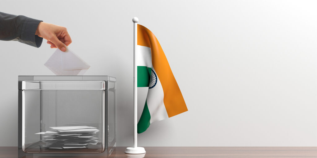 Glass ballot box and a small India flag. 3d illustration